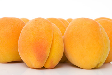 close up of a apricots against white background