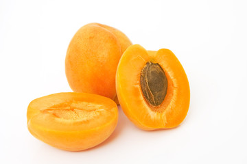 studio shot of fresh apricots isolated against white background