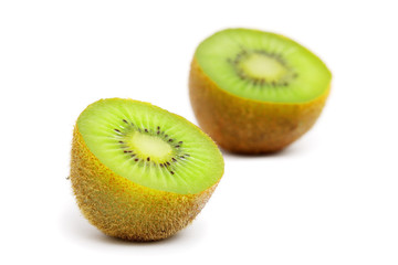 Fototapeta premium A kiwi fruit sliced into half on white background.