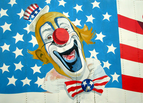 Painting of Uncle Sam on American Stars and Stripes flag.