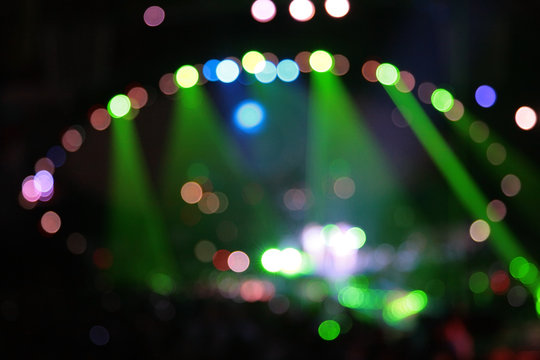 abstract defocused color spotlights on concert