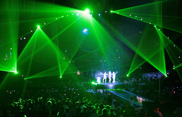 actress on stage. laser beams. concert