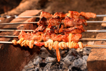 Appetizing shish kebab on metal skewers