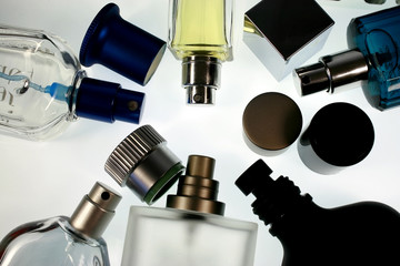different shapes of perfume bottles and caps