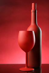 Red wine bottle and glass close-up