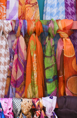 Close-up image of some colorful scarfs made of silk.