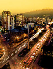 A busy road in Santiago with the Andes in the background