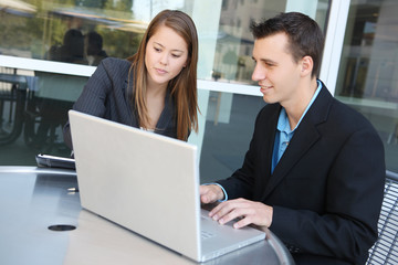 Fototapeta na wymiar Man and woman business team on laptop computer