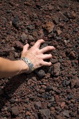 woman take volcanic stones