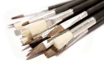 Fototapeta premium Assorted paintbrushes over white background