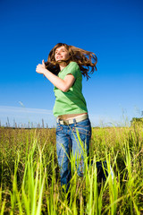 Happy young woman enjoying summer. Running.