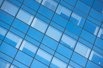 Close up of office building windows with blue glass