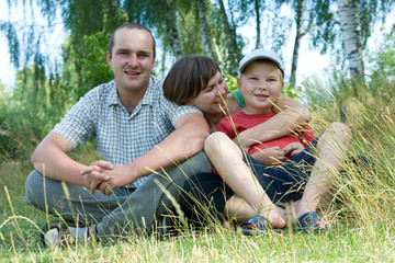 Naklejka na ściany i meble happy family spending time together on a summer day