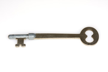 Macro shot of an antique key on white background