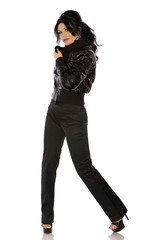 pretty woman wearing black outfit on white background