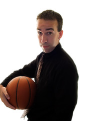 A businessman holding a basketball under his arm