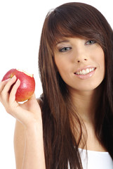 Beautiful young woman eating apple. Isolated over white