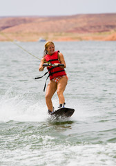Fototapeta premium Athletic Girl Wake boarding at Powell