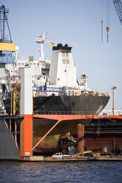 ship in dry dock - large container ship with propeller