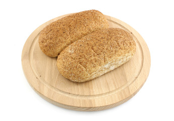 two breads on wooden plate