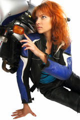 Obraz na płótnie Canvas Sexy girl with motorcycle equipment
