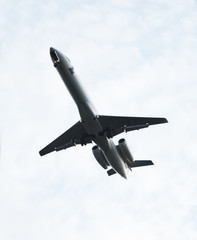 Flight of the plane in the dark blue sky
