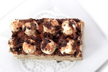 Chocolate Cake on a Plate Isolated on White Background