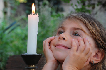 smiling girl and candle