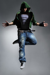 cool looking dancer makes a difficult jump