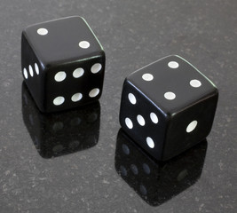 a pair of dice that have come up six