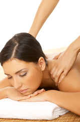 Beautiful brunette woman taking massage