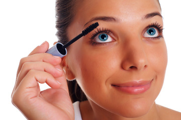 Fototapeta premium Beatifull woman paints eyelashes