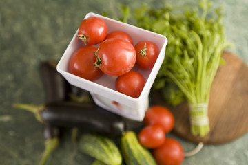 white kitchen scale and vegetable cucumber and tomato