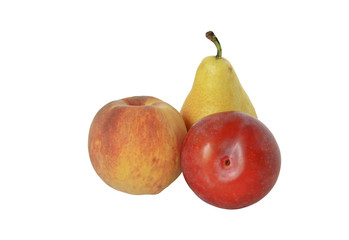 Fresh pear, peach and plum lying on white background