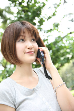 young woman talks on the cell phone