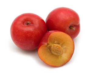 slice red plum on white background