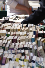 Looking through old books in a second hand sale