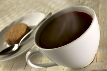 black coffee and cookie for breakfast close up