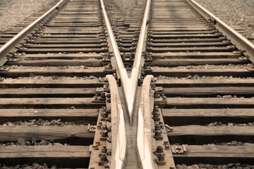 Two meet railroad tracks.