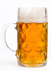 Mug full of beer at white background