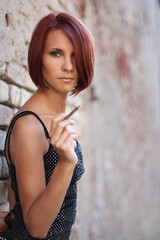 sexy young girl near old wall