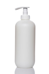 Plastic pump soap bottle reflected on white background