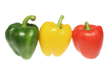 Green yellow and red bell peppers isolated on white