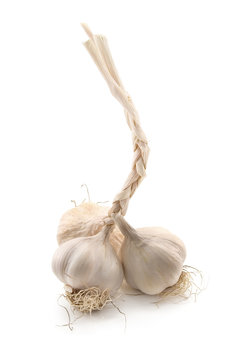 three garlic isolated on white