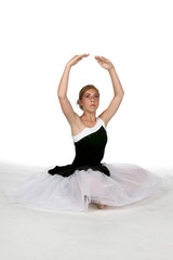 Fototapeta premium ballerina with arms extended into fifth position