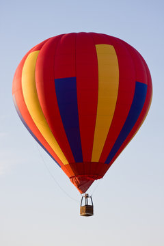 No one on board Colorful hot air balloon mid-air on a clear day