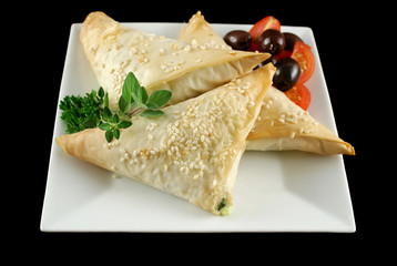 Spinach and feta cheese triangles with olives
