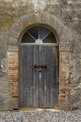 Fototapeta na wymiar Old grey door