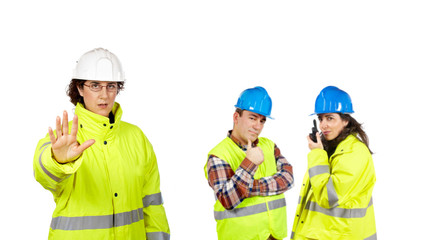 Construction workers over a white background. Focus at front