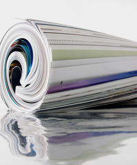 rolled up magazine with reflection